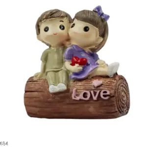 Romantic Couple Figurine on Wooden Log with "Love" Inscription ₹213